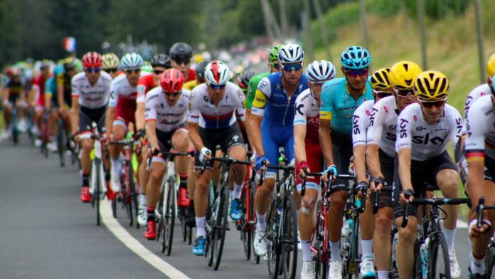 group of men riding bicycle