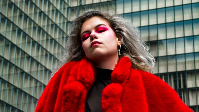 woman in red cardigan