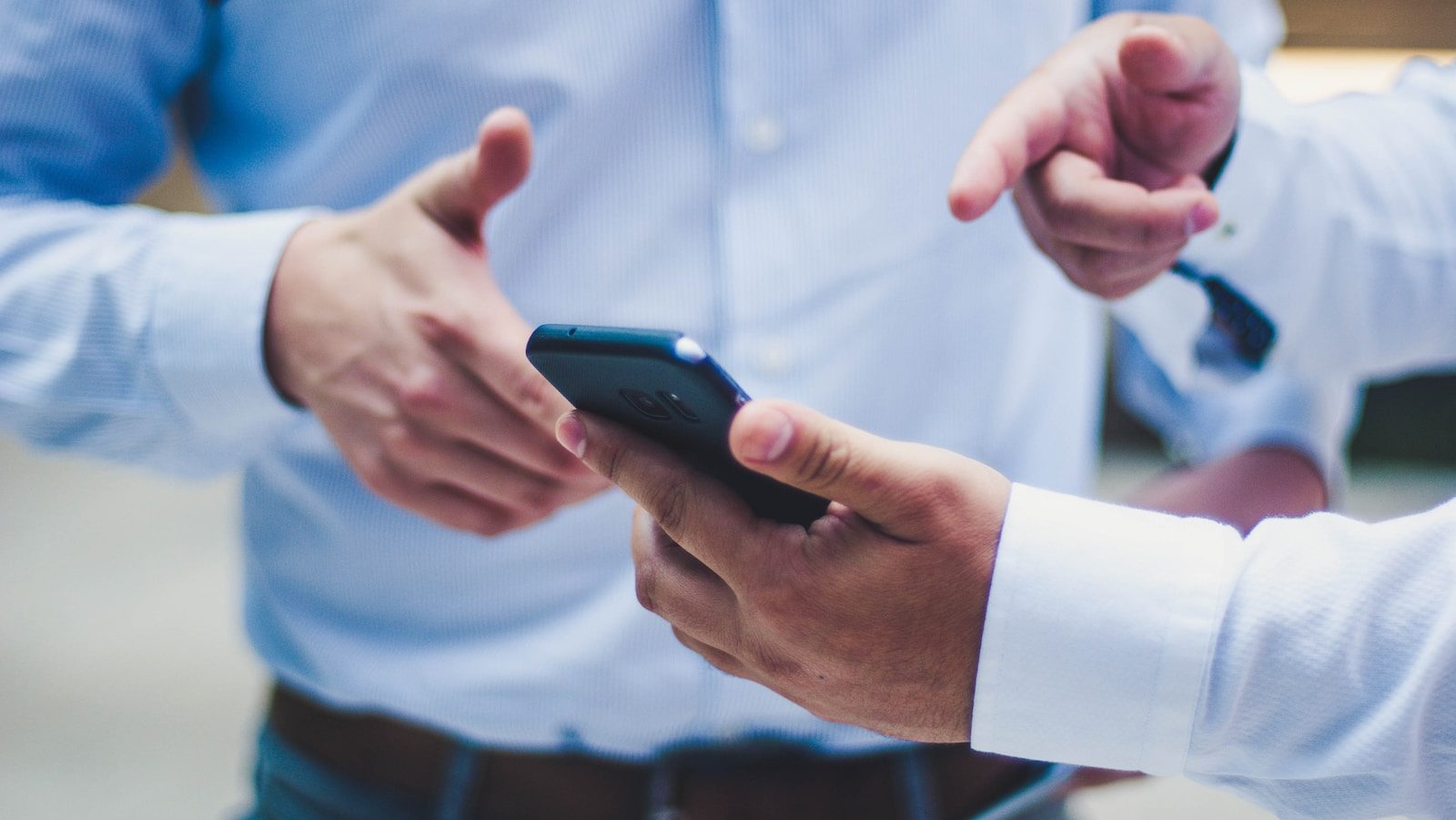 person holding black smartphone