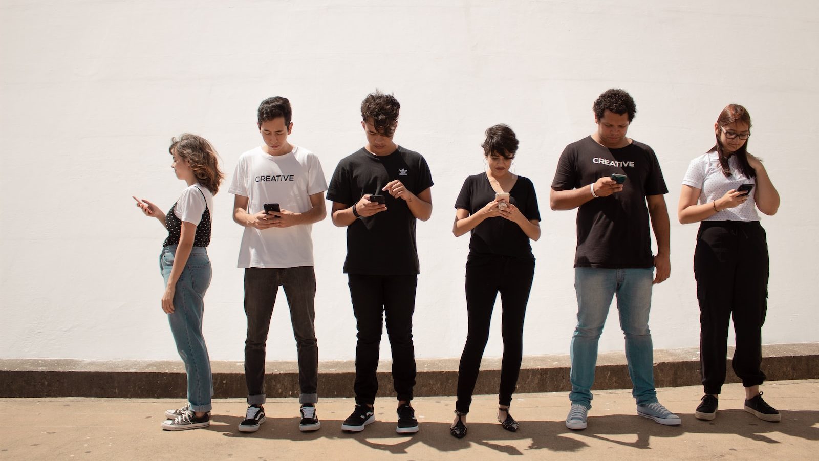 group of people standing on brown floor