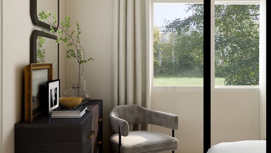 white and gray sofa chair near glass window