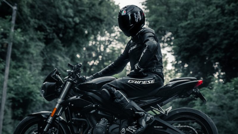 man in black motorcycle helmet riding motorcycle during daytime
