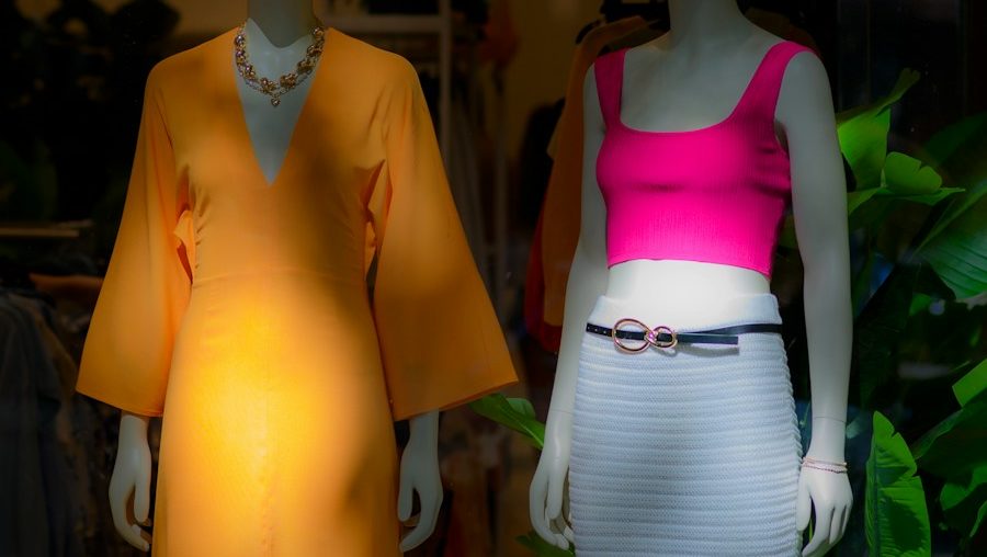 a couple of mannequins wearing clothing