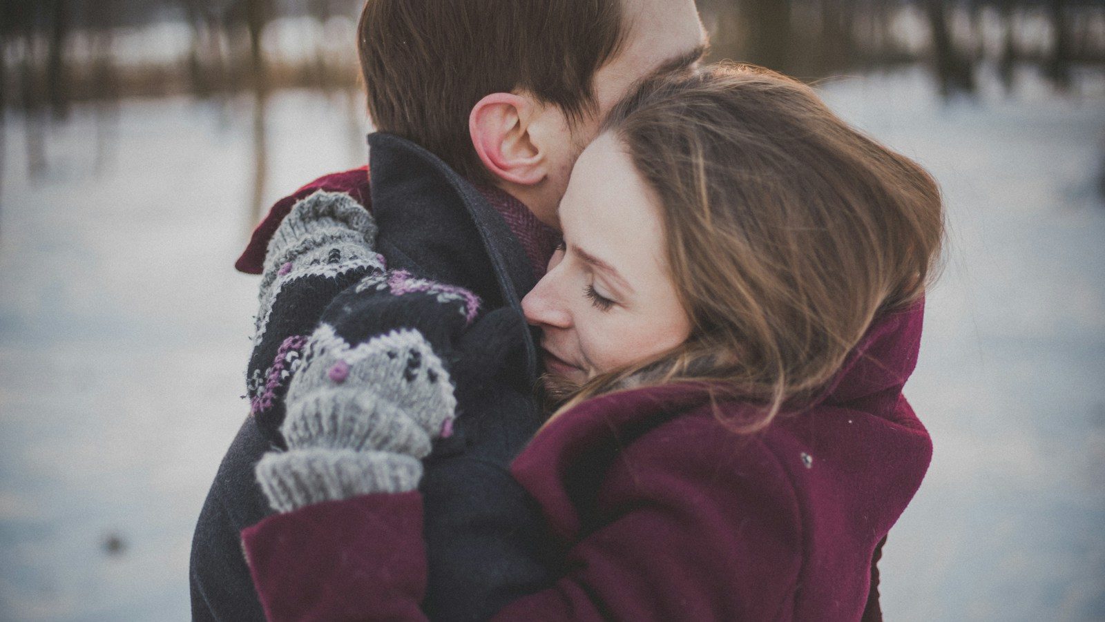 man and woman hugging each other